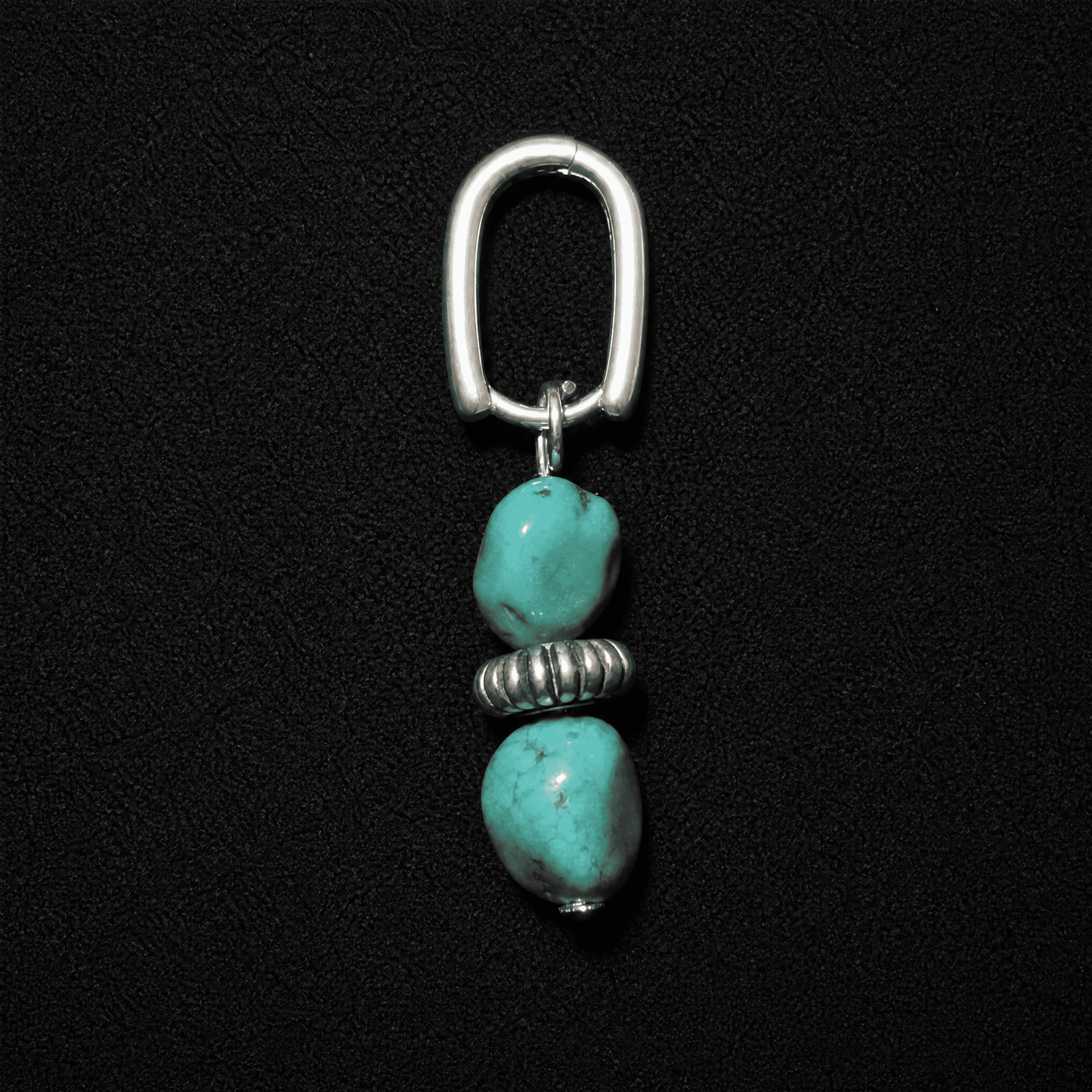 Artisan heritage style S925 silver hoop earrings featuring raw turquoise nuggets, displayed on a textured neutral fabric