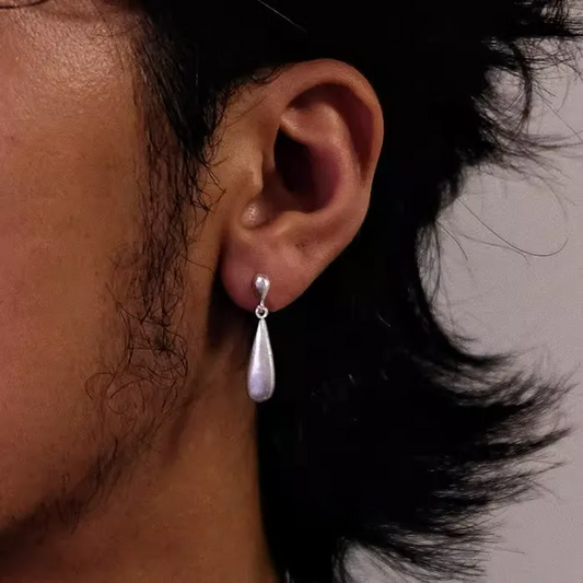 Brushed 925 Sterling Silver Teardrop Earrings Matte Waterdrop Dangles worn on ear with smooth matte finish and elegant design