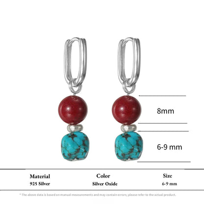 Silver rectangular hoop earrings with red cinnabar and raw turquoise beads.