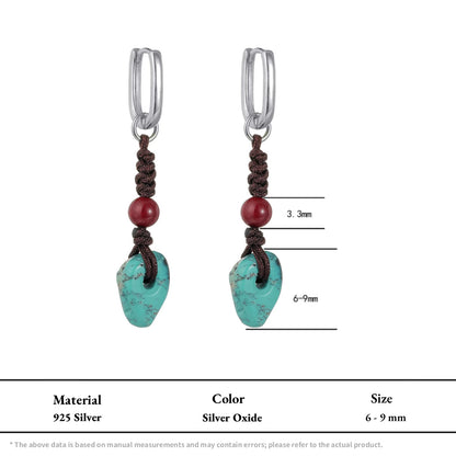 Pair of silver hoop earrings with hand-knotted cord, red beads, and turquoise stones.