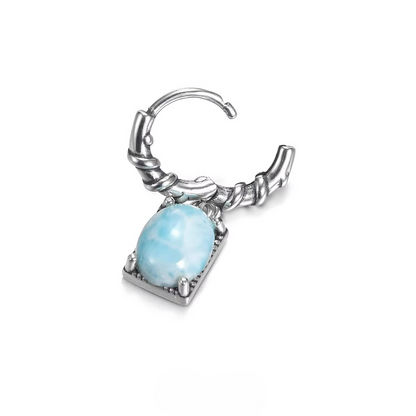 Open silver huggie earring with a dangling light blue larimar stone.