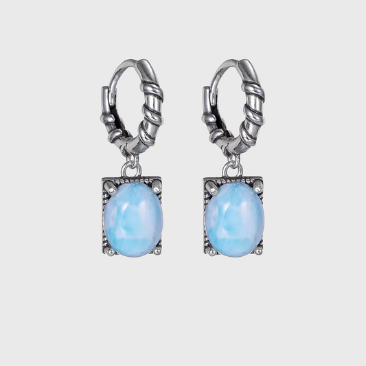Vintage sterling silver drop earrings with oval light blue Larimar stones.