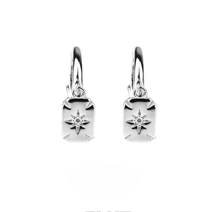 Two shiny silver huggie earrings with star-embossed rectangular drop charms.