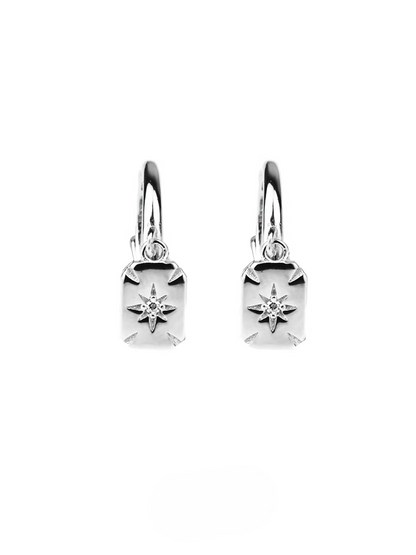 Shiny silver huggie earrings with rectangular celestial star drops and clear gems.