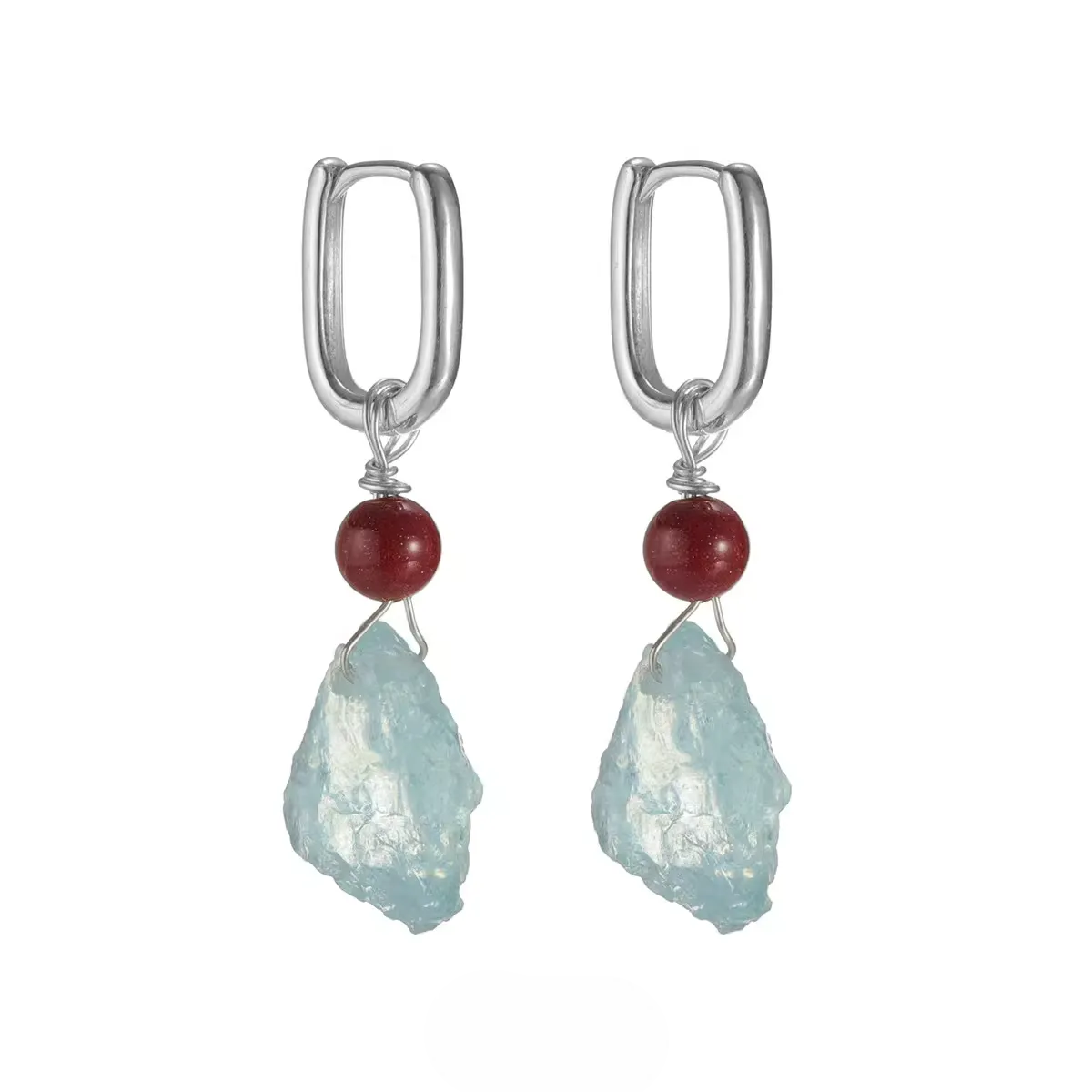 Pair of silver hoop earrings with red cinnabar beads and raw aquamarine stones.