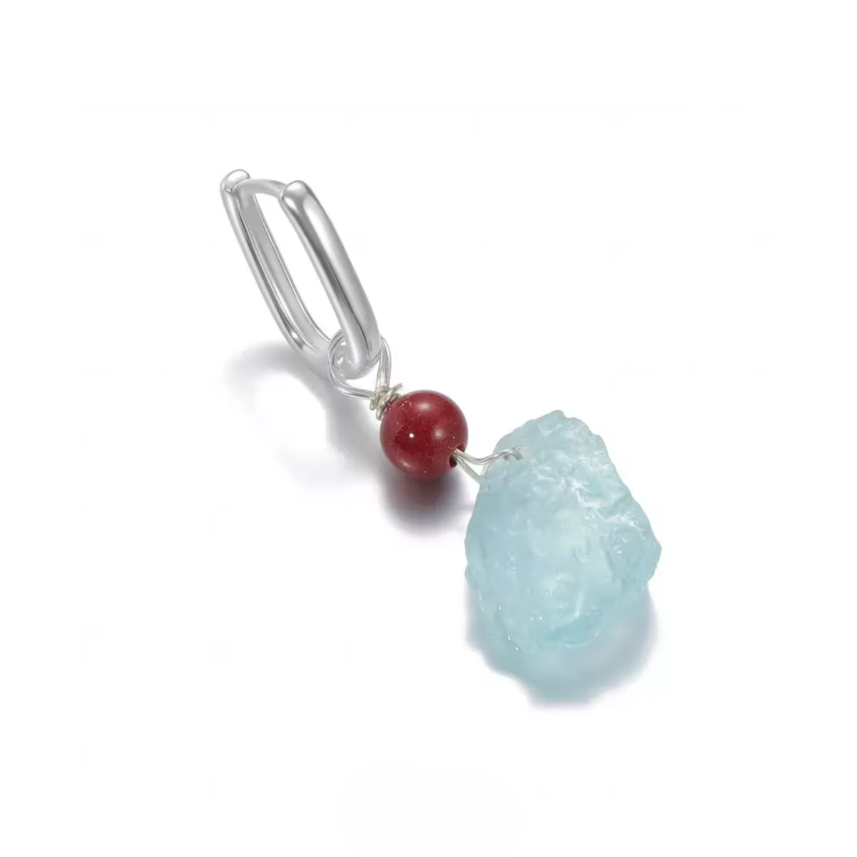 Silver dangle earring with a red bead and raw light blue stone.