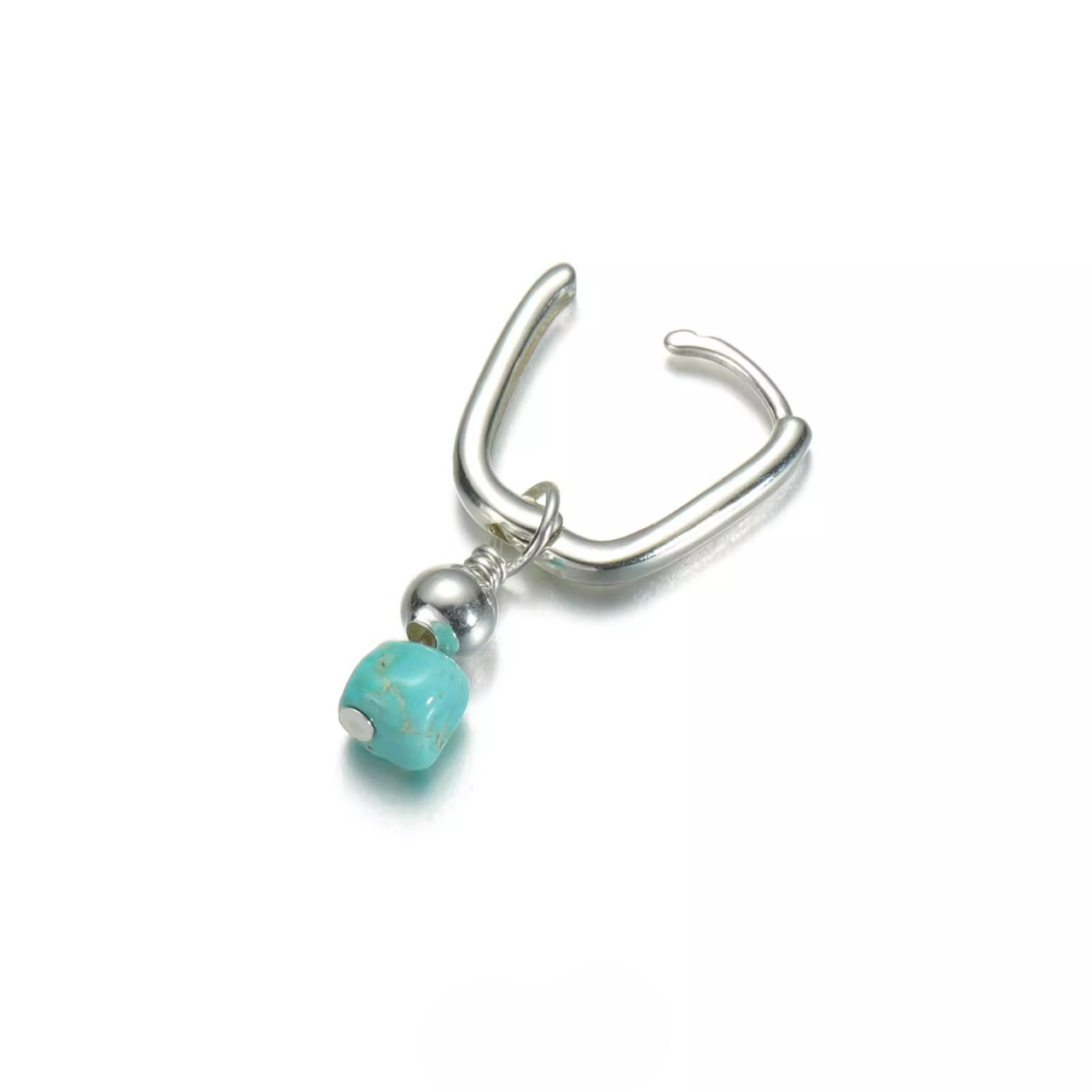 Silver rectangular huggie earring with a raw turquoise nugget drop.