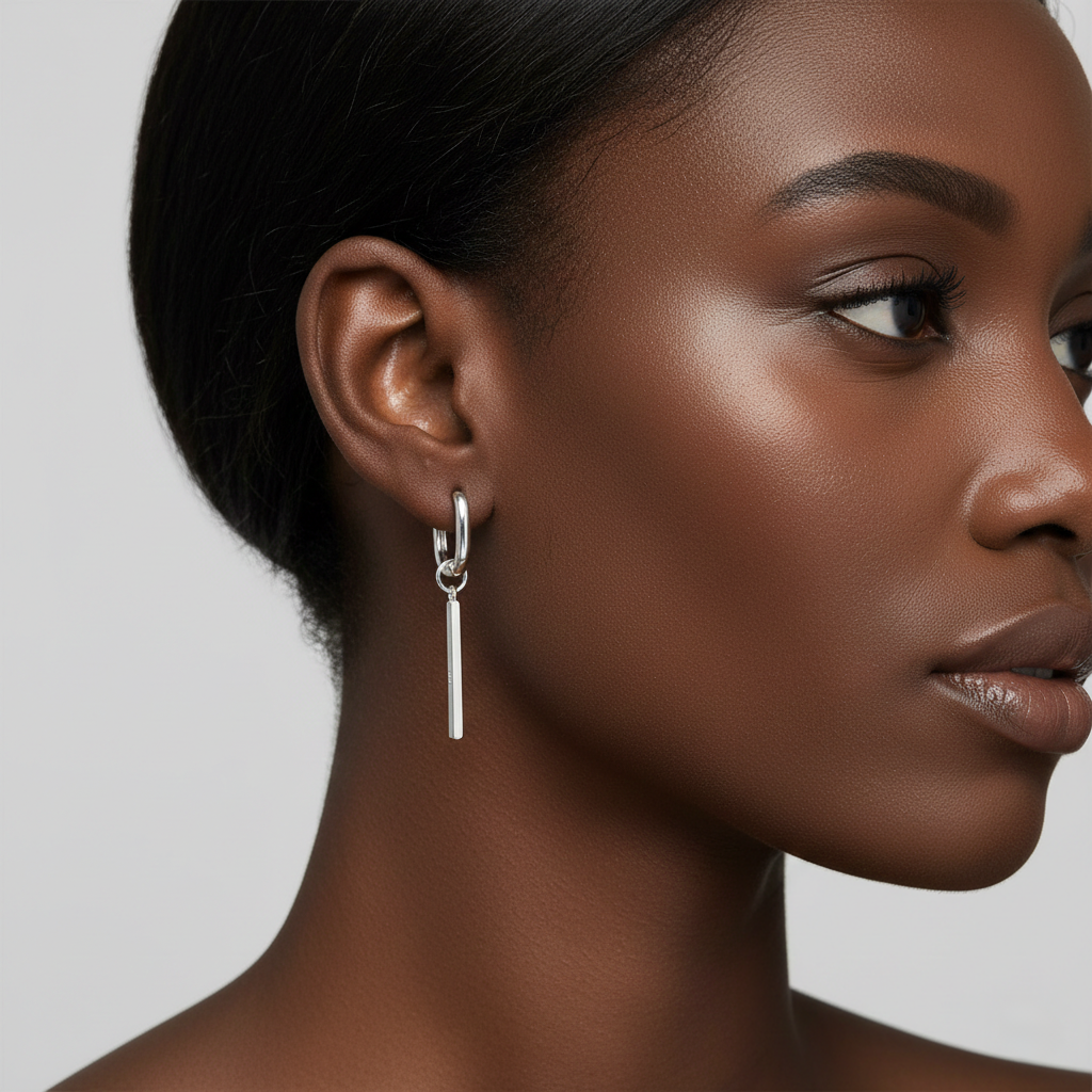 Silver Rectangular Huggie Hoops with Bar Dangle Sleek Geometric Studs on model with smooth skin and neutral background